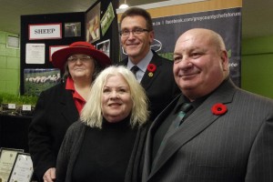 Chair of Grey County Chefs’ Forum Charmaine Peever and MPP Bill Walker standing behind Chefs’ Forum board member Linda Reader and MP Larry Miller at official opening of the Chefs’ Forum Food Distribution Hub in Flesherton.
